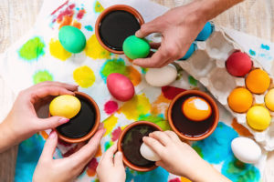 family paints easter eggs. Selective focus. celebration.